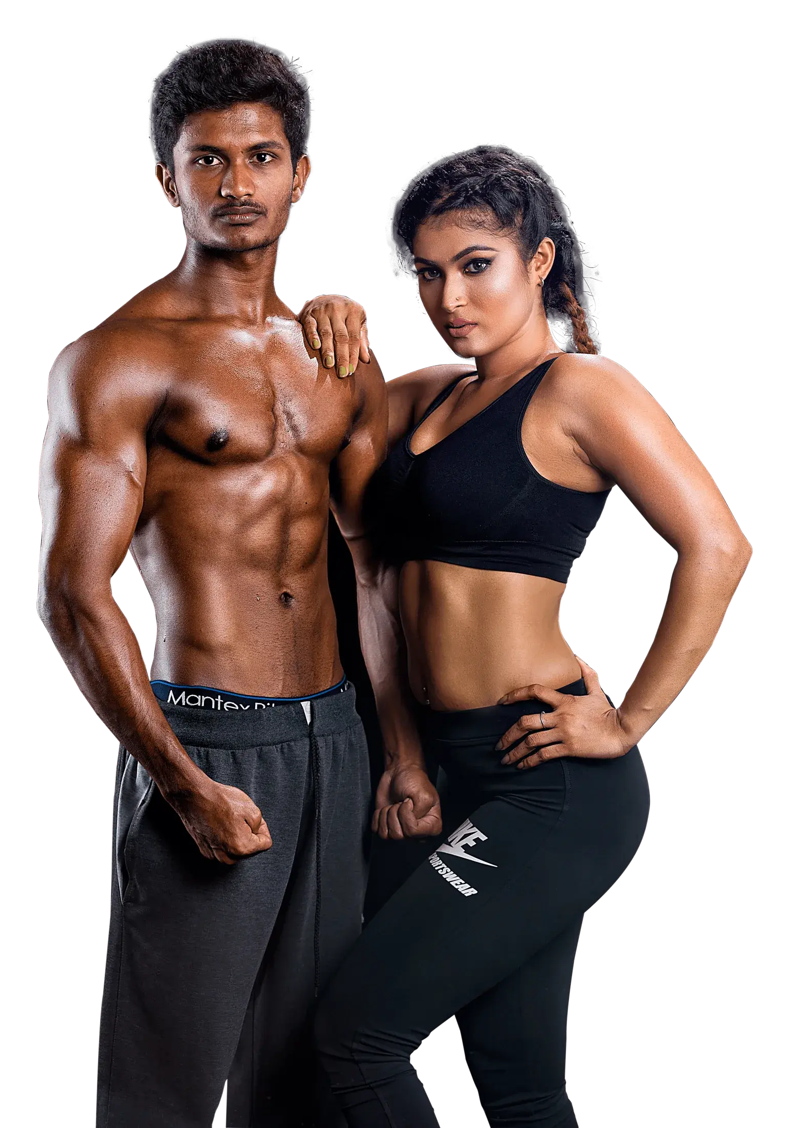A man and a woman stand side by side facing the camera, her hand on his shoulder, in black gym wear